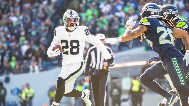 Nov 27, 2022; Seattle, Washington, USA; Las Vegas Raiders running back Josh Jacobs (28) rushes against the Seattle Seahawks during the first quarter at Lumen Field. Mandatory Credit: Joe Nicholson-USA TODAY Sports